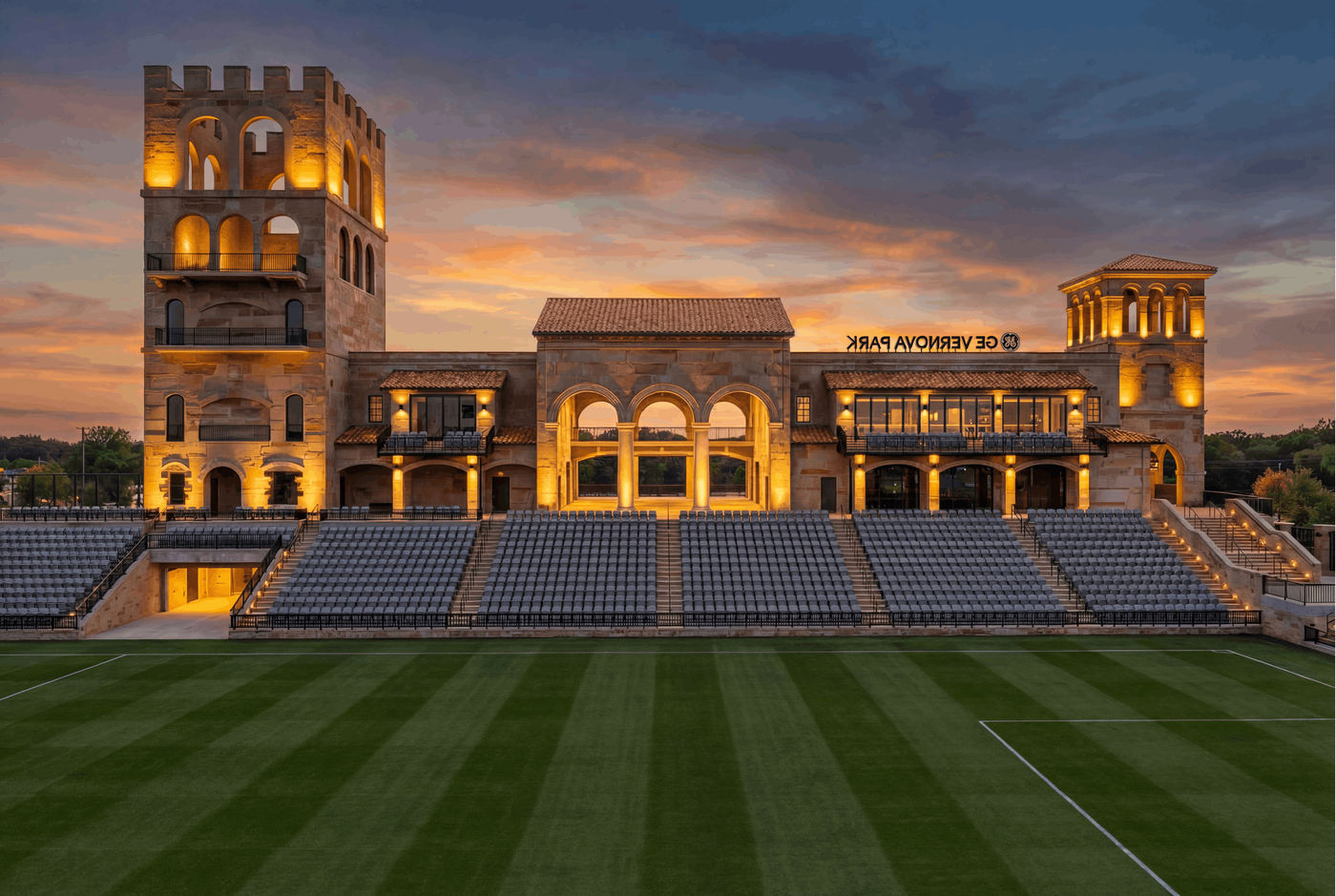 Render of the west building at GE Vernova Park from midfield, with the Founders Club rows in front of it